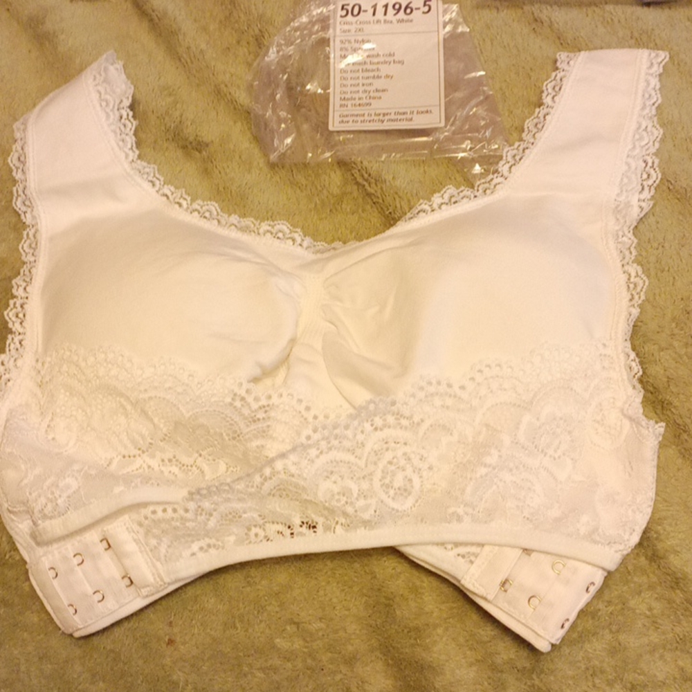2 Crisscross lift bras new in packages size 2xl . 2 bras white and lavender
